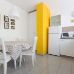 Fully equipped kitchen with dining table for 5 persons and big windows with lots of light.