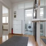 Entrance area with closet and a big mirror.