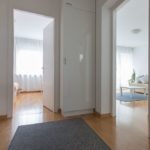 Entrance area with closet and a big mirror.