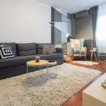 Living room with double sofa bed, tv, armchair end exit to the terrace.