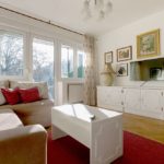 Living room with double sofa bed, smart TV and exit to the sunny terrace.