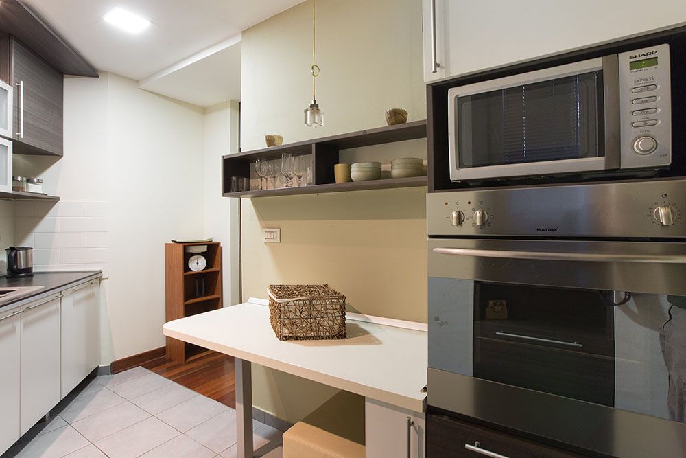 Fully equipped kitchen with big fridge, microwave dishwasher and oven
