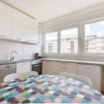Fully equipped kitchen with dining table for 5 persons and big windows with lots of light.